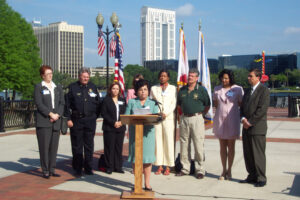 Commissioner Mary Johnson addresses the media on victims rights.