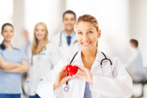 Nurse holding a heart